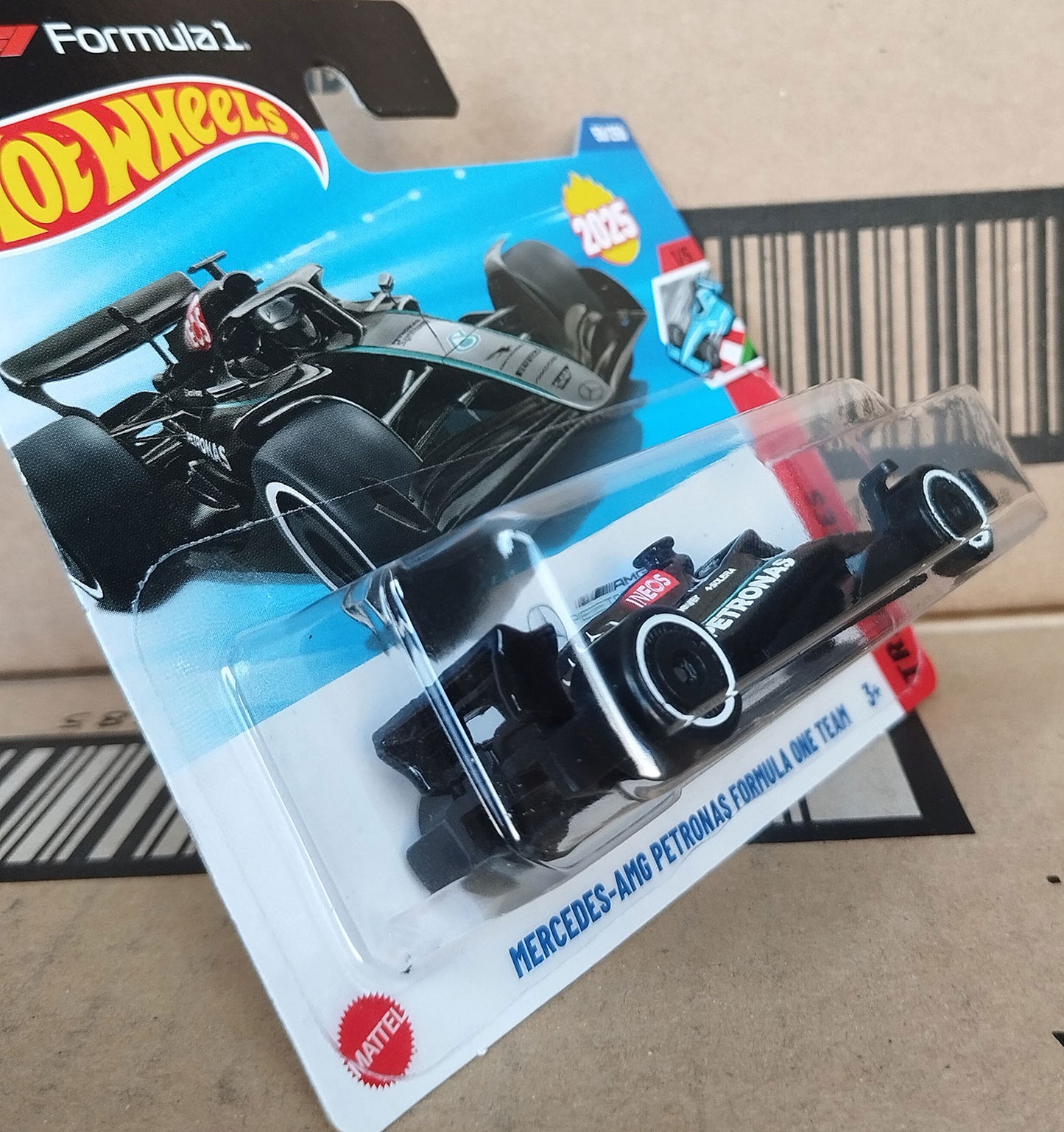 Hot Wheels Mercedes AMG Petronas Formula 1 diecast 1/64 car 2025 perspective view in original packaging