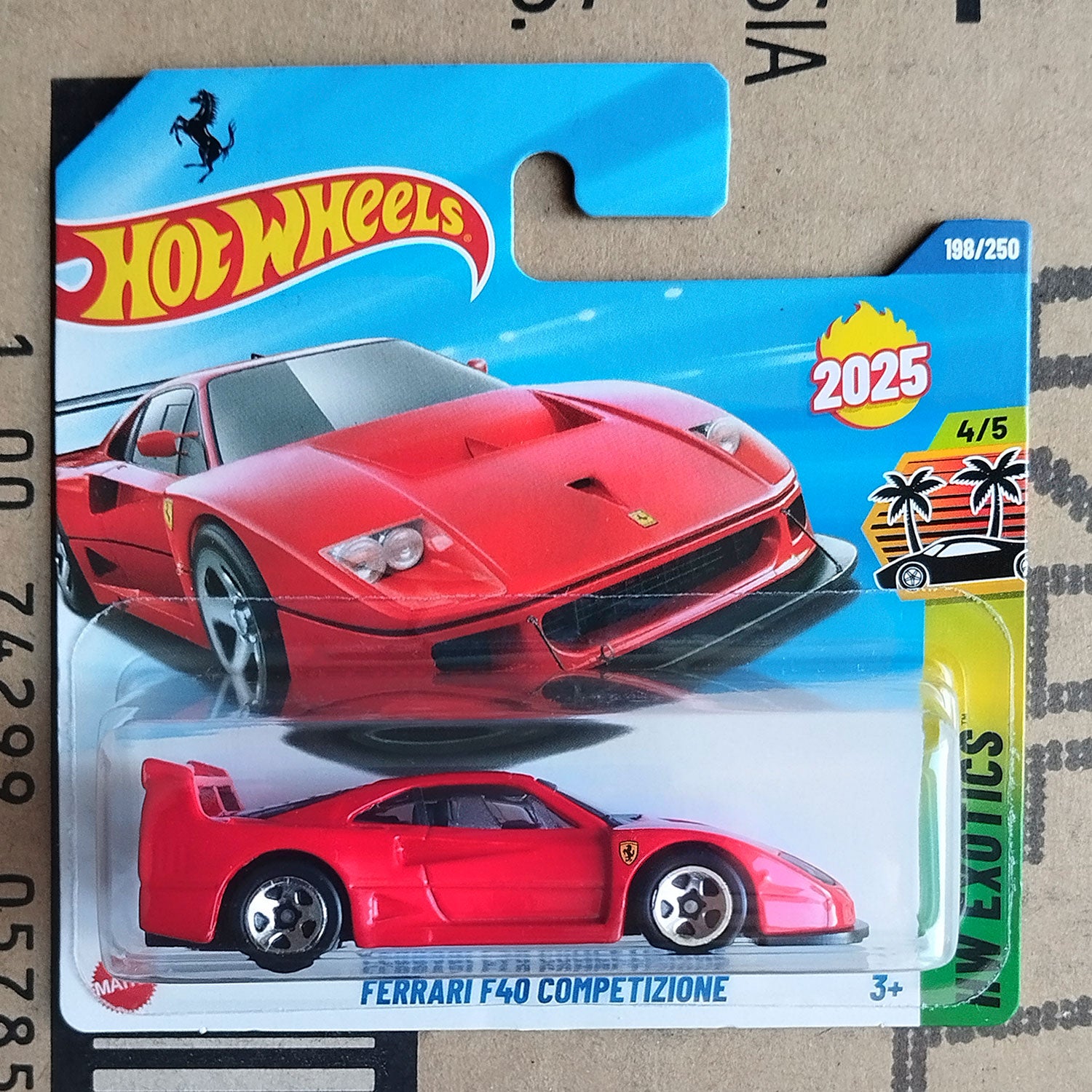 Hot Wheels Ferrari F40 Competizione toy car in packaging on a cardboard background