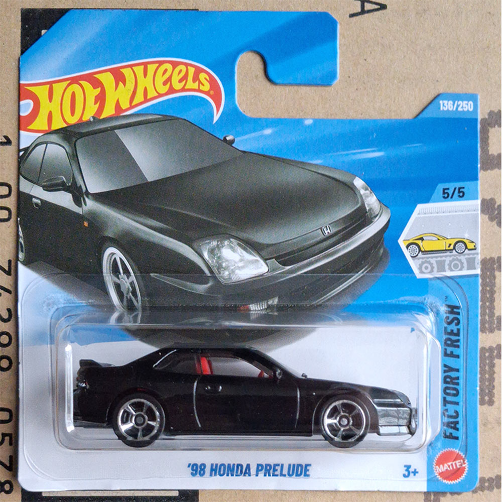 Hot Wheels Factory Fresh '98 Honda Prelude die-cast toy car in its original blister card packaging, featuring a black car with red interior accents.