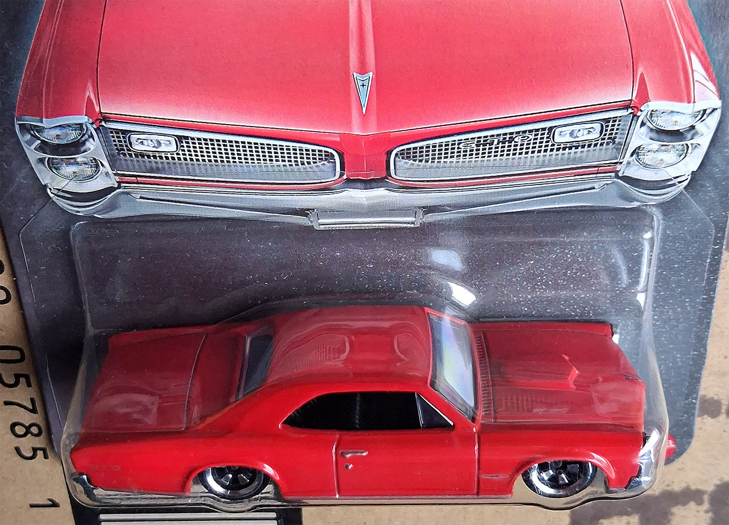 Close-up front view of Hot Wheels 1966 Pontiac GTO diecast model showing grille and headlights