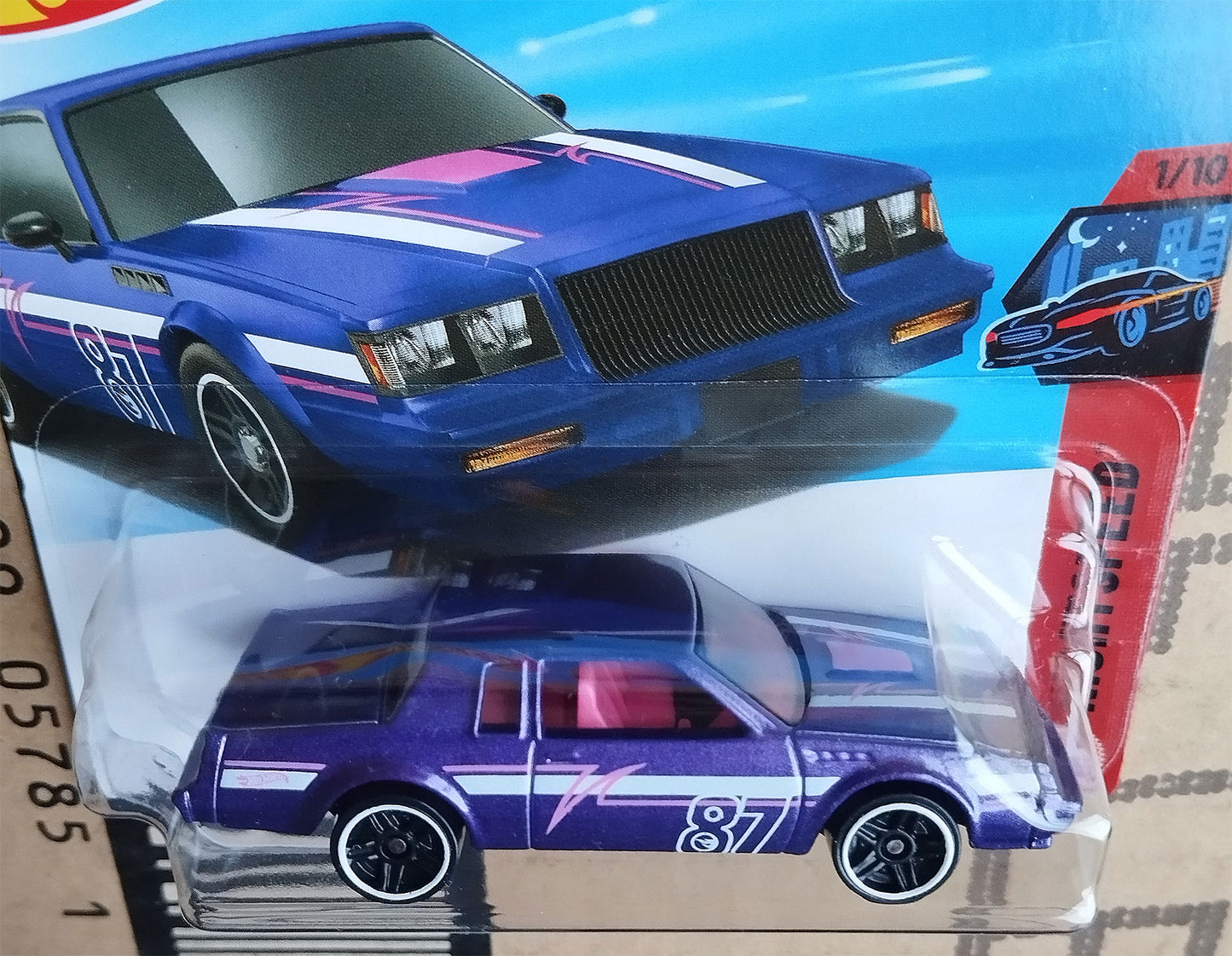 Front angled close-up of Hot Wheels Treasure Hunt 1987 Buick Regal GNX 1/64 diecast muscle car in sealed packaging