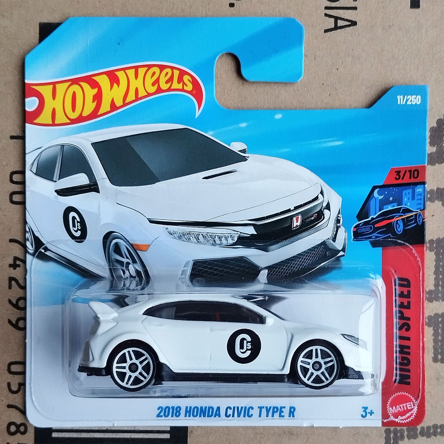 Hot Wheels 2018 Honda Civic Type R die-cast toy car in its original blister packaging, featuring a white car model with a black circular 'C' decal on the side.