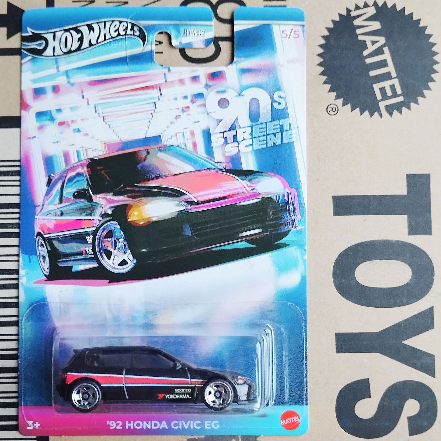 A Hot Wheels Mattel '92 Honda Civic EG toy car in its original blister card packaging, displayed on a cardboard box with a Mattel logo.