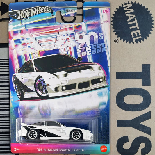 Hot Wheels Mattel 1996 Nissan 180SX Type X die-cast toy car in its original blister card packaging, displayed next to a cardboard box with 'TOYS' printed on it.