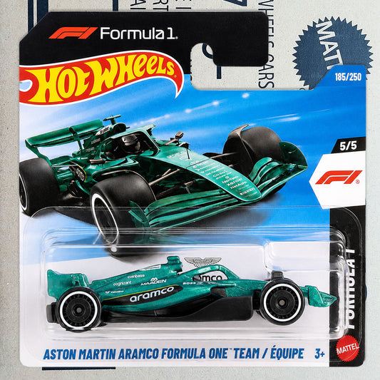 A Hot Wheels Mattel Formula 1 toy car in its original blister packaging, featuring a green Aston Martin Aramco Formula One team livery.
