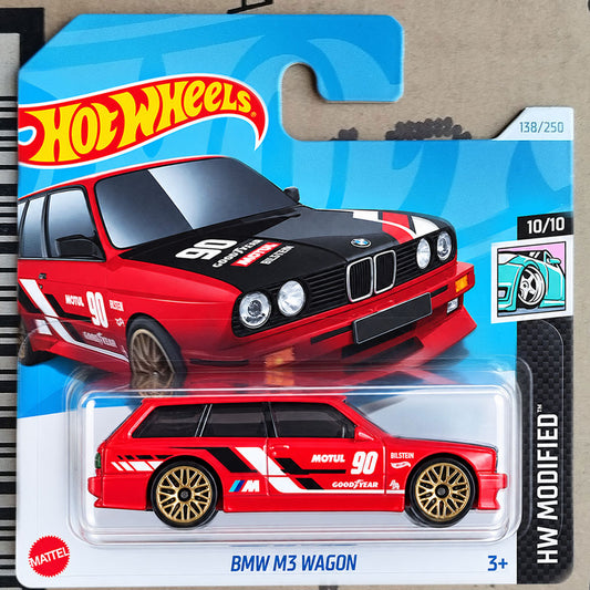 Hot Wheels die-cast toy car of a BMW M3 Wagon, featuring a red and black livery with white racing decals and gold wheels, packaged on its original blue and white card.
