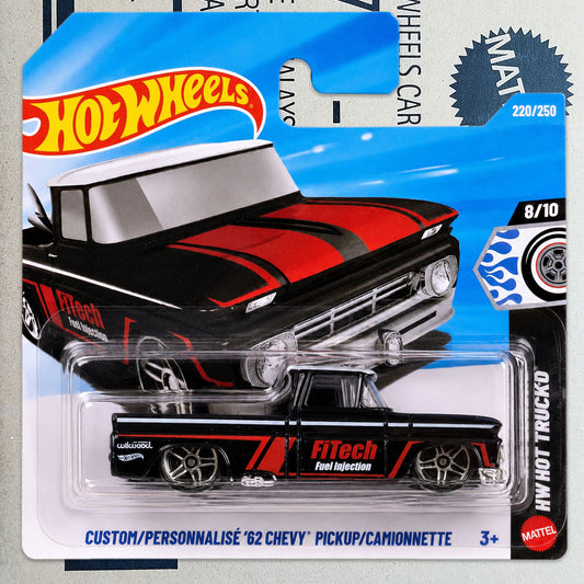 Hot Wheels Mattel '62 Chevy Pickup die-cast toy car in its original blister card packaging, featuring a black and red classic Chevy pickup truck design with FiTech Fuel Injection graphics.