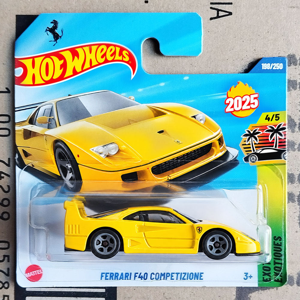Hot Wheels Mattel Ferrari F40 Competizione die-cast toy car in its original blister card packaging, featuring a bright yellow car on a blue and white card with a 2025 holiday edition badge.