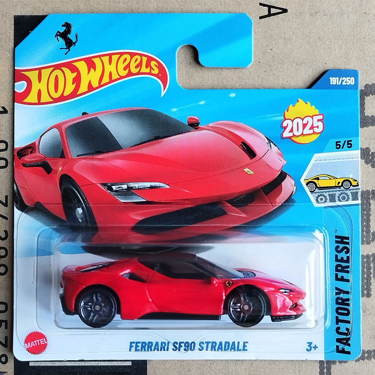 Hot Wheels Ferrari SF90 Stradale toy car in packaging with Hot Wheels logo.