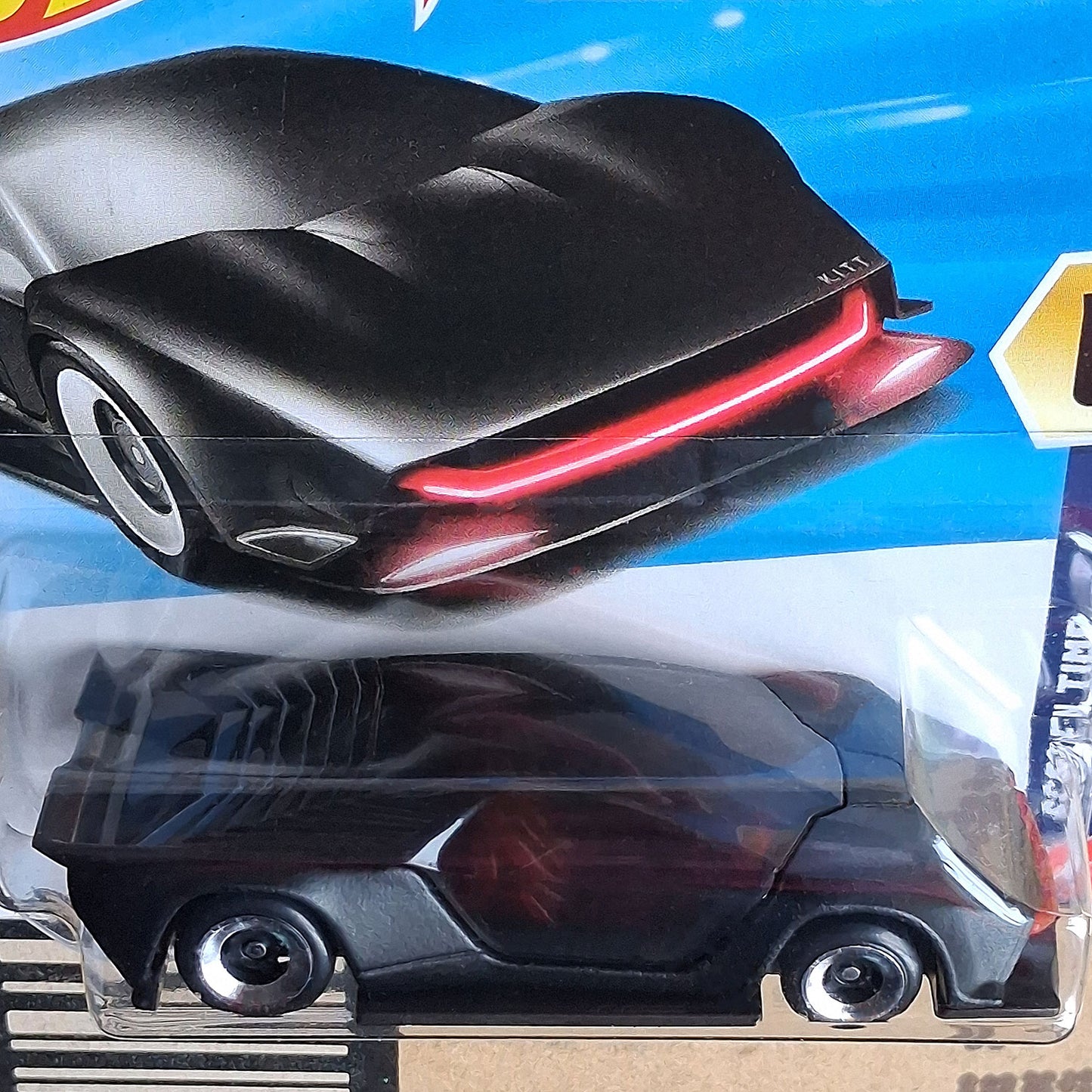 Close-up of Hot Wheels Knight Rider K.I.T.T. Concept 1/64 diecast showing signature red scanner light in sealed packaging