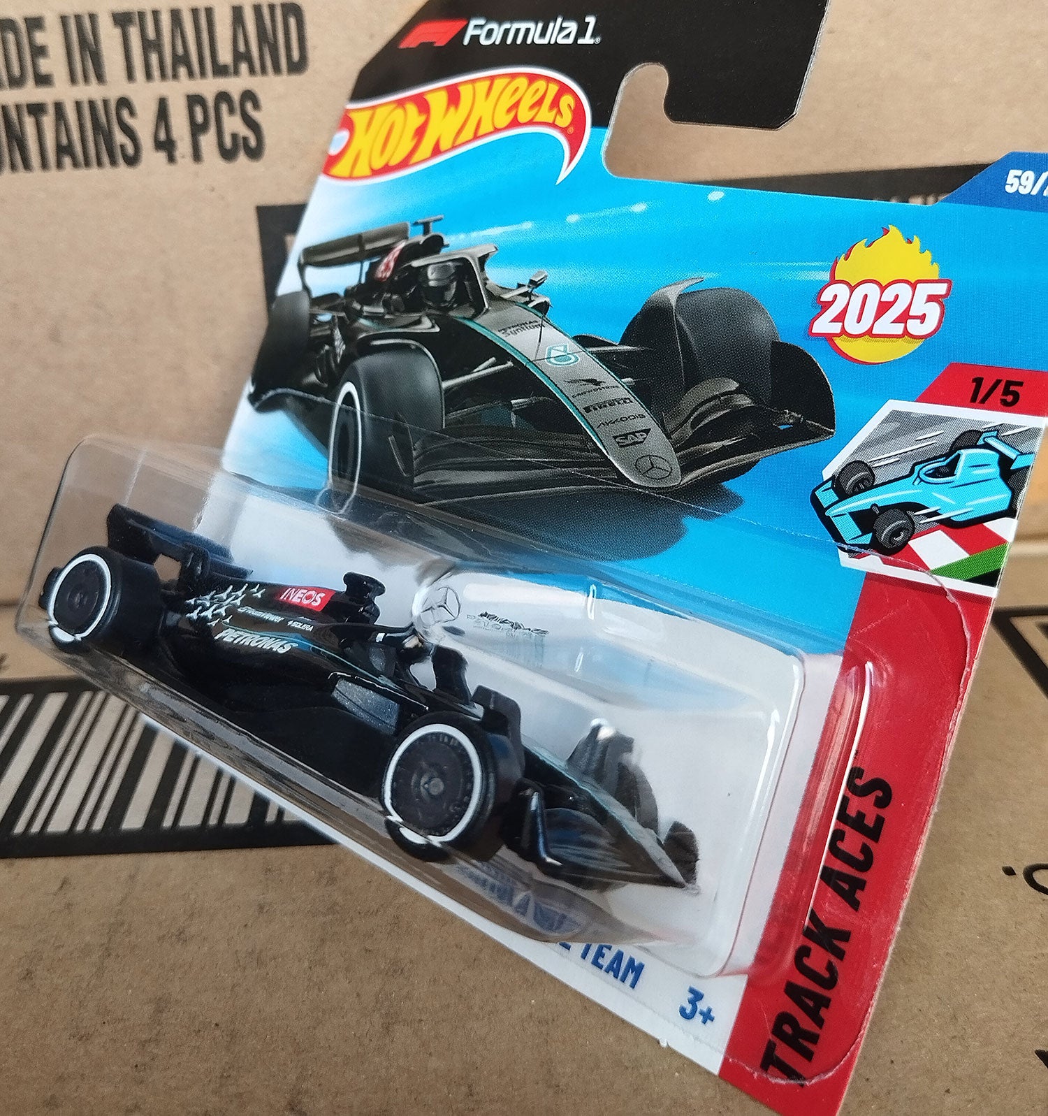 Hot Wheels Mercedes AMG Petronas Formula 1 diecast 1/64 car 2025 angled view in original packaging