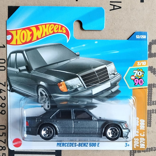 Hot Wheels Mercedes-Benz 500 E toy car in packaging on a cardboard background