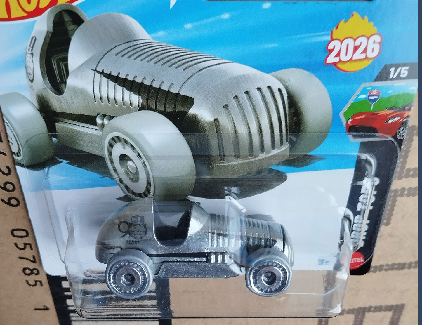 Hot Wheels Monopoly 90 Years Pass’n Go 1/64 diecast collectible car close-up in original packaging