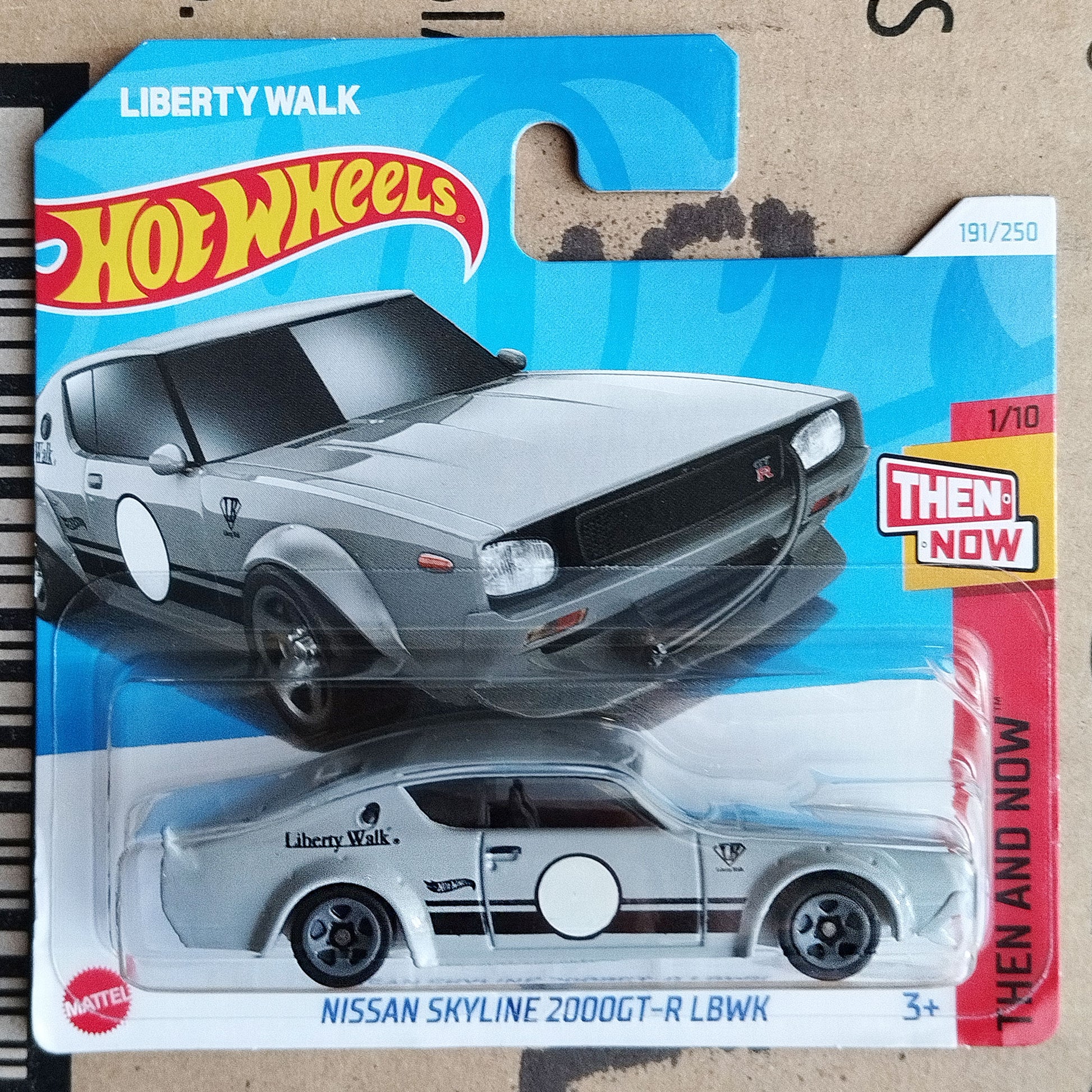 Hot Wheels toy car package featuring a silver Nissan Skyline R32 2000GT-R LBWK die-cast model car in its original blister packaging with a blue cardback.
