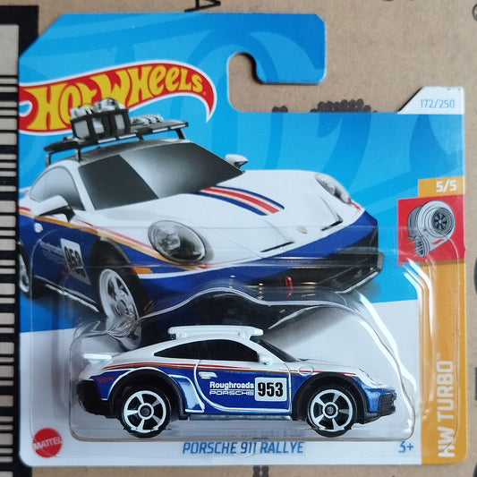 Hot Wheels toy car in its original blister packaging, featuring a white, blue, and red Porsche 911 Rallye die-cast model with 'Roughroads Porsche Racing' livery.
