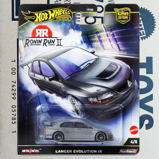 Hot Wheels Premiums RR Culture Metal/Metallic Ronin Run II Lancer Evolution IX toy car in its original blister card packaging, featuring a silver die-cast model car and a large graphic of a black sports car on the backing card.