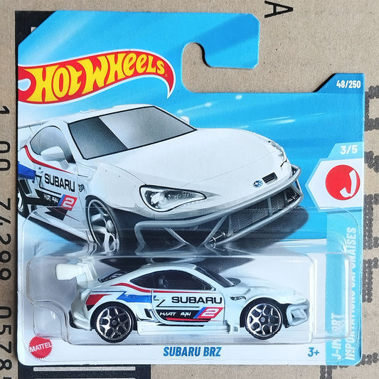 Hot Wheels Mattel Subaru Brz die-cast toy car in its original blister packaging, featuring a white race car with blue and red decals.