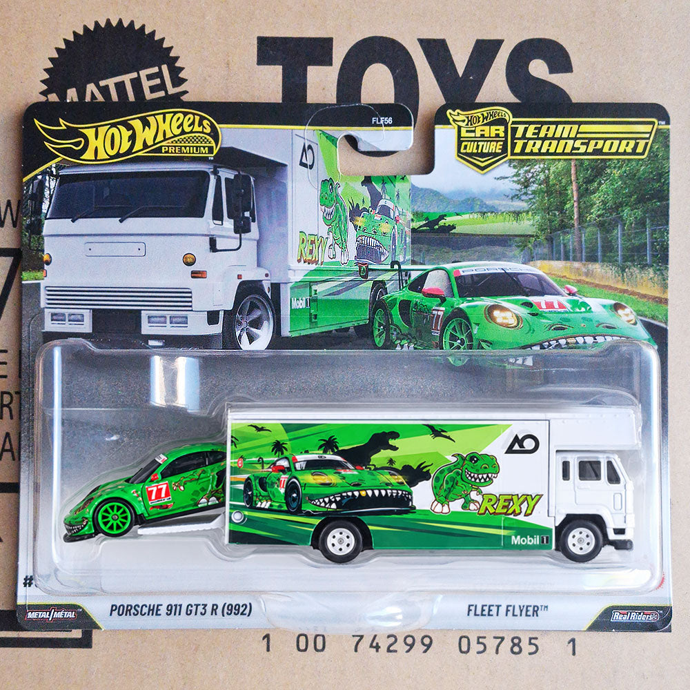 Hot Wheels Premium Team Transport Porsche 911 GT3 R (992) REXY green AO Racing #77 diecast race car with matching Fleet Flyer truck, dinosaur graphics, original packaging.