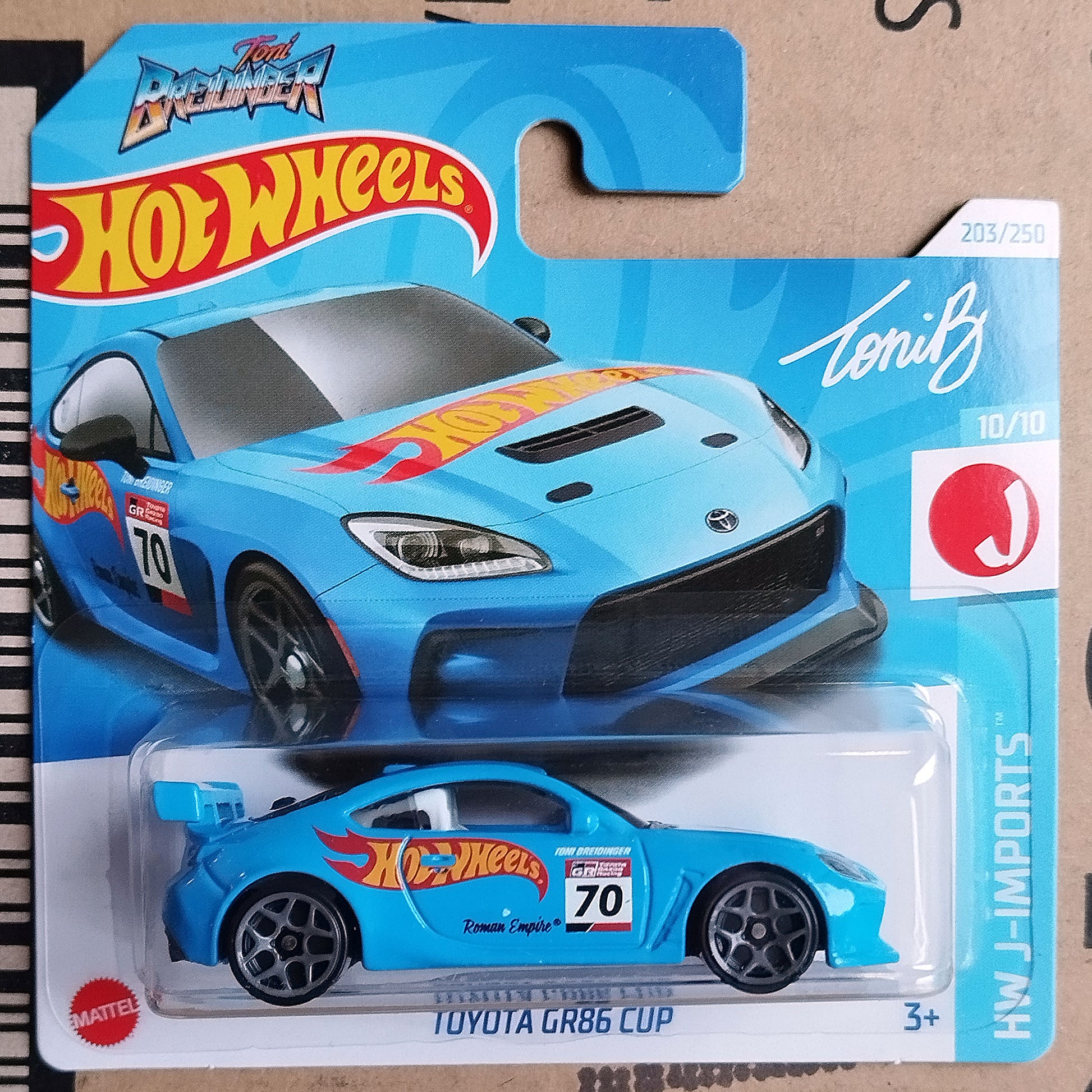 Hot Wheels toy car in its original blister card packaging, featuring a blue Toyota GR86 Cup with custom racing decals and a blue background.