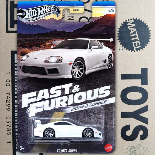 Hot Wheels Silver Series Fast & Furious Mattel die-cast toy car of a white Toyota Supra, displayed in its original blister pack packaging.