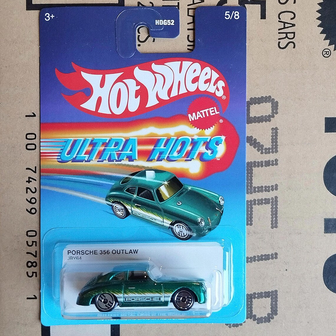 A Hot Wheels Ultra Hots die-cast toy car in its original blister card packaging, featuring a green Porsche 356 Outlaw. The card displays the Hot Wheels and Mattel logos, along with the model name 'PORSCHE 356 OUTLAW Jena'.