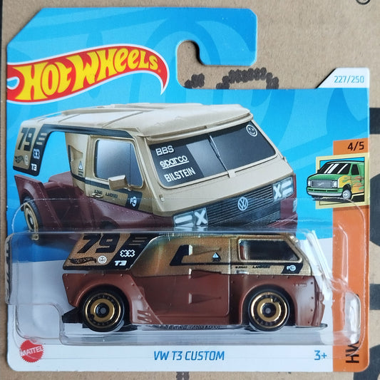 Hot Wheels die-cast toy car of a customized brown and beige Volkswagen T3 van, packaged on its original blue and orange blister card.