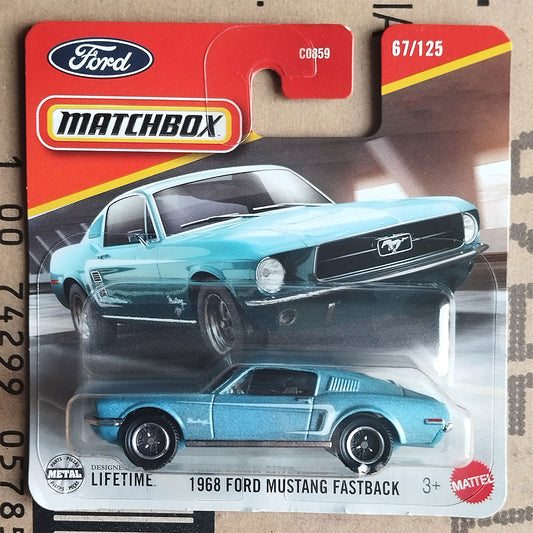 Matchbox die-cast toy car of a 1968 Ford Mustang Fastback in metallic blue, in its original red and white blister card packaging.