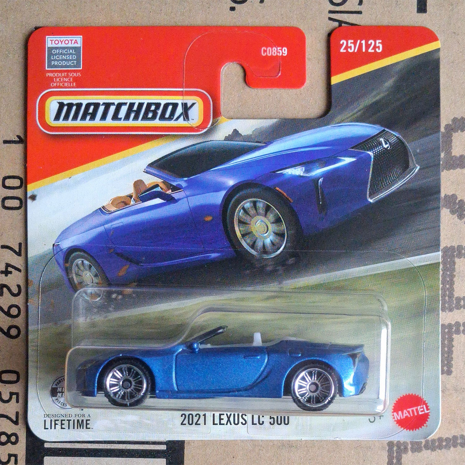 A Matchbox Mattel 2021 Lexus LC 500 die-cast toy car in its original blister card packaging, featuring a blue convertible design.