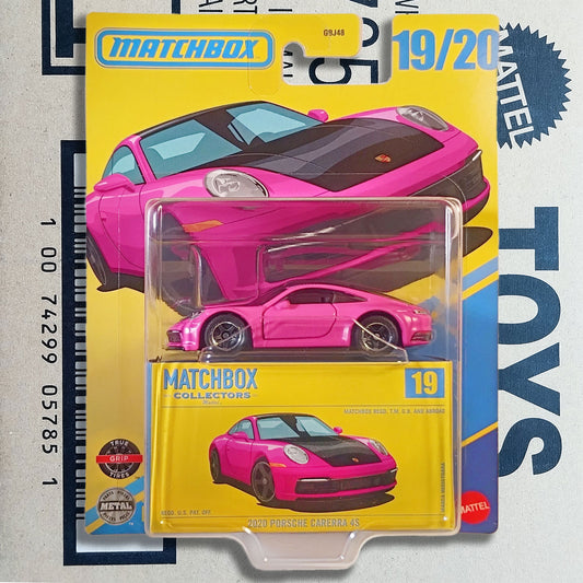 Matchbox Collectors 19 Porsche 911 Carrera S die-cast toy car in its original yellow blister card packaging, featuring a bright pink car with a black hood.
