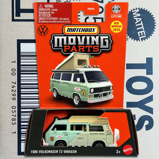 Matchbox Moving Parts 1986 Volkswagen T3 Vanagon toy car in its original orange blister packaging, with the car also shown outside the packaging in front. The toy van is light green with a beige pop-up roof and small yellow, red, and white decals.
