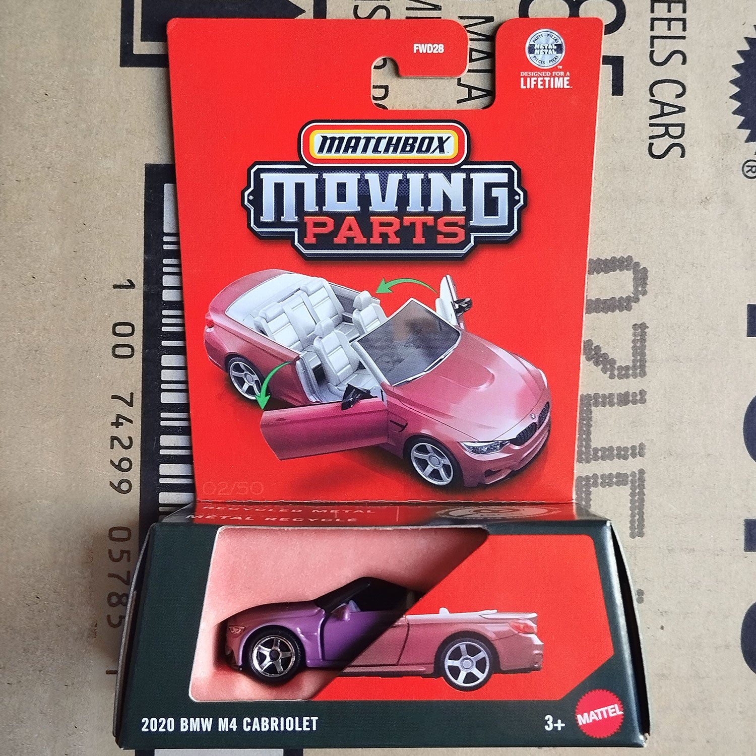 Matchbox Moving Parts toy car in its original red blister packaging, featuring a 2020 BMW M4 Cabriolet die-cast model. The red backing card displays the Matchbox logo and an illustration of the toy car with its convertible top open.