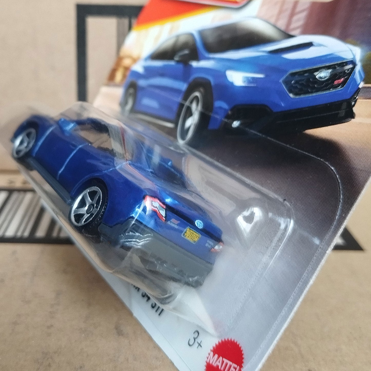 Matchbox 2024 Subaru WRX S4 STI diecast 1/64 blue car rear angle view in original packaging