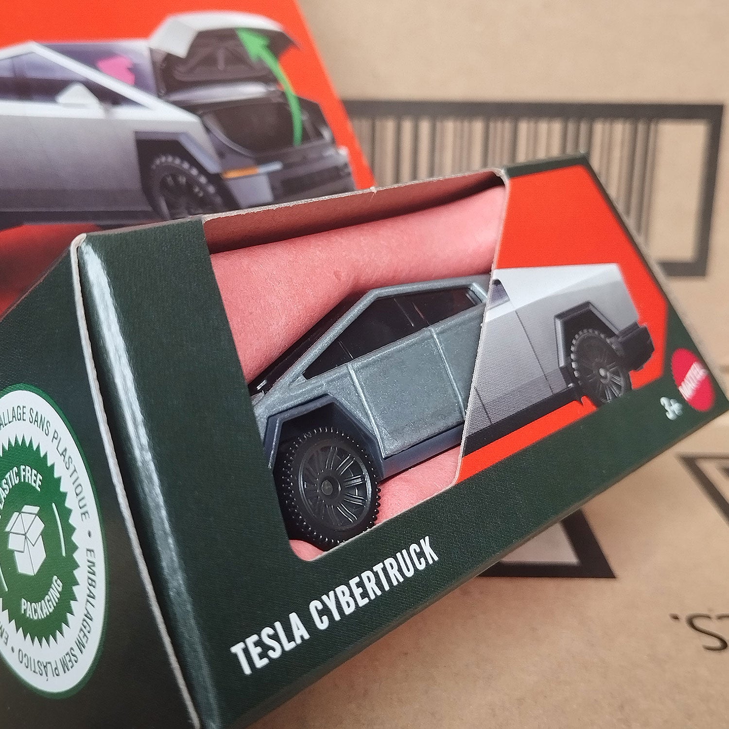 Matchbox Moving Parts Tesla Cybertruck 1/64 diecast model in eco-friendly box packaging angled view.