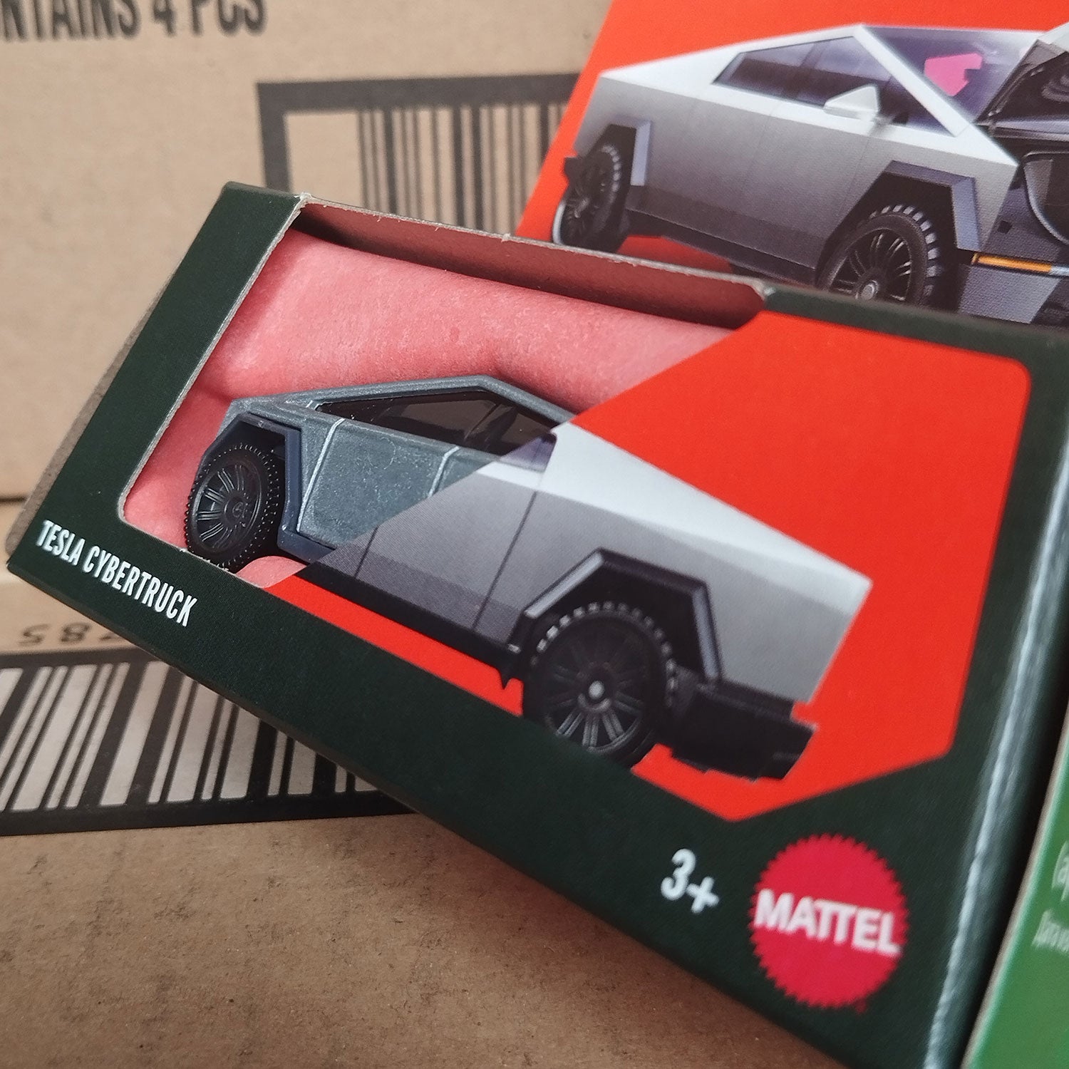 Close-up of Matchbox Tesla Cybertruck Moving Parts packaging showing 1/64 diecast model inside box.