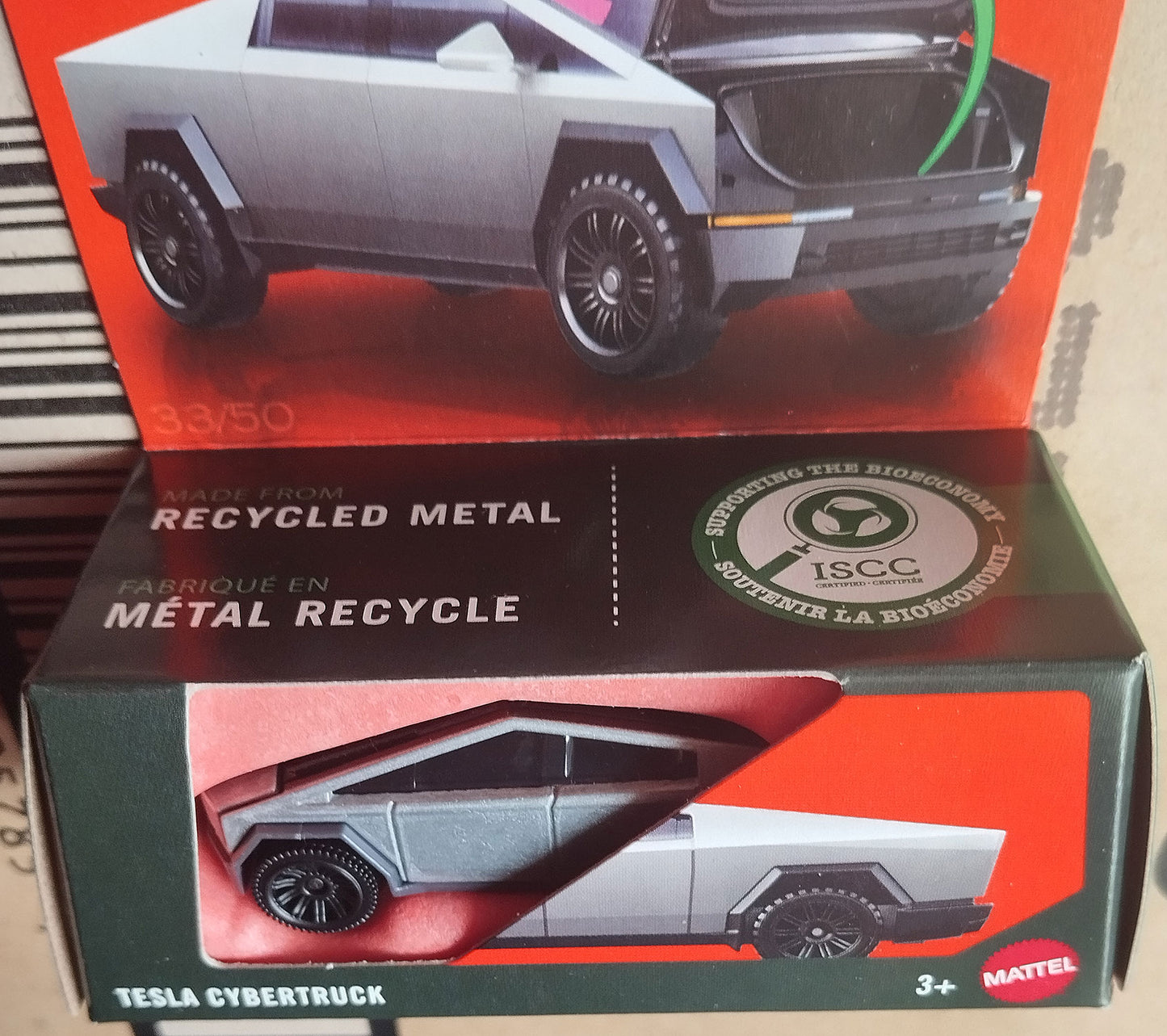 Matchbox Tesla Cybertruck 1/64 diecast model in recycled metal eco packaging with ISCC certification badge.