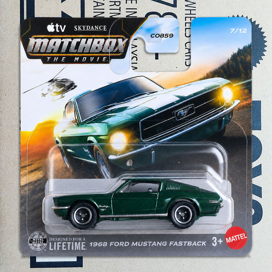 A Matchbox The Movie die-cast toy car of a 1968 Ford Mustang Fastback in dark green, packaged on its original cardback featuring a large photo of the car and branding.